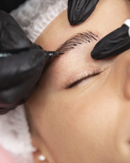 beautiful-young-woman-going-through-microblading-treatment